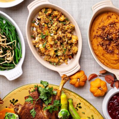 Picture of fresh holiday side dishes, including green beans, stuffing, and mashed sweet potatoes.