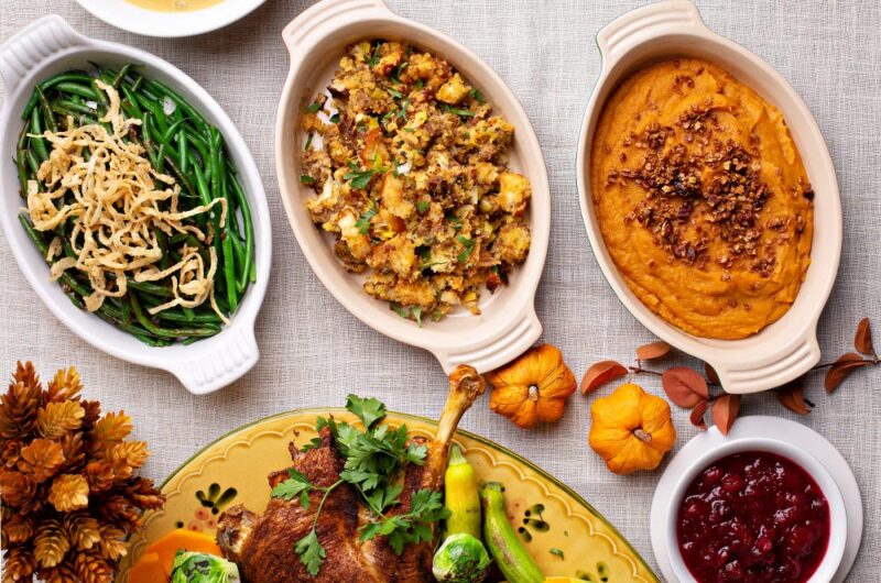 Picture of fresh holiday side dishes, including green beans, stuffing, and mashed sweet potatoes.